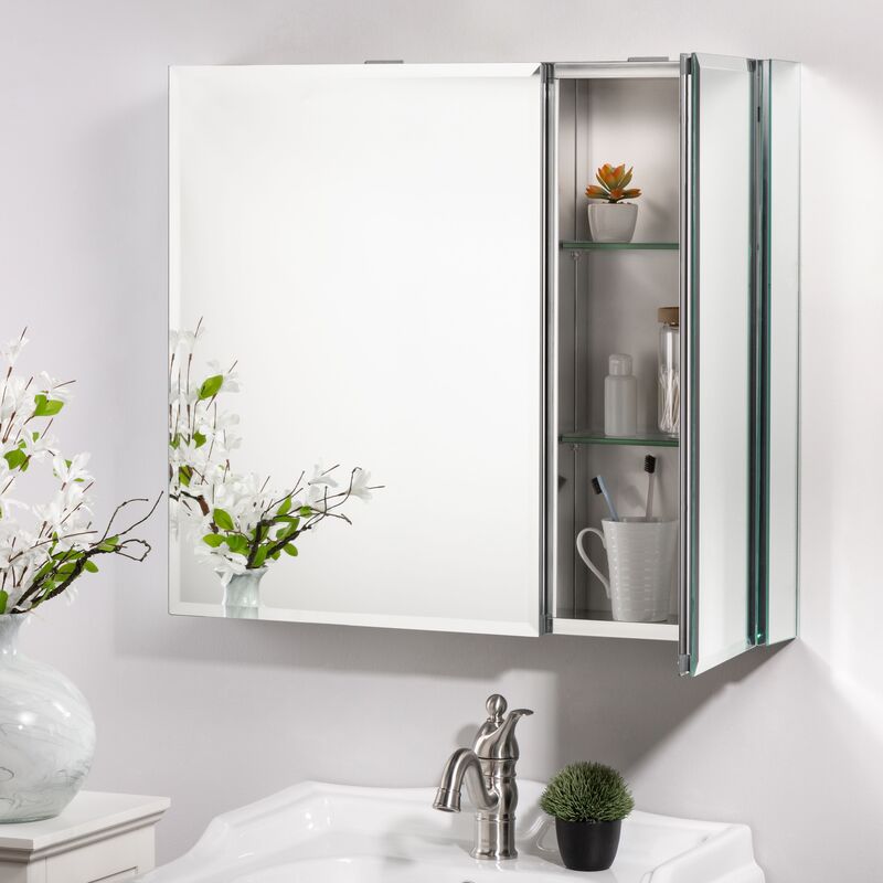 A frameless medicine cabinet with a recessed design and soft-close hinges in a contemporary bathroom