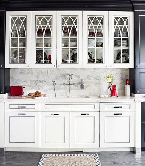 Arch-top glass front cabinet in a classic kitchen