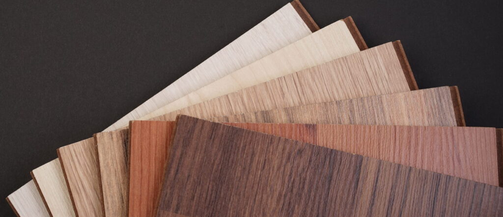 Veneered plywood cabinet door samples showcasing oak, maple, and walnut species