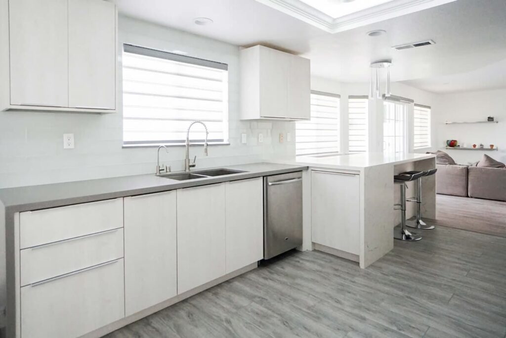 Flat panel kitchen cabinet doors in matte white finish