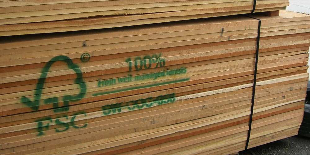 FSC-certified panels being inspected for surface quality in a Vietnamese furniture factory operated by a leading furniture manufacturer in Vietnam