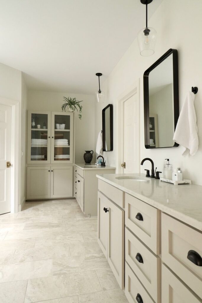 Taupe bathroom cabinet colors with bronze hardware in hotel bathrooms