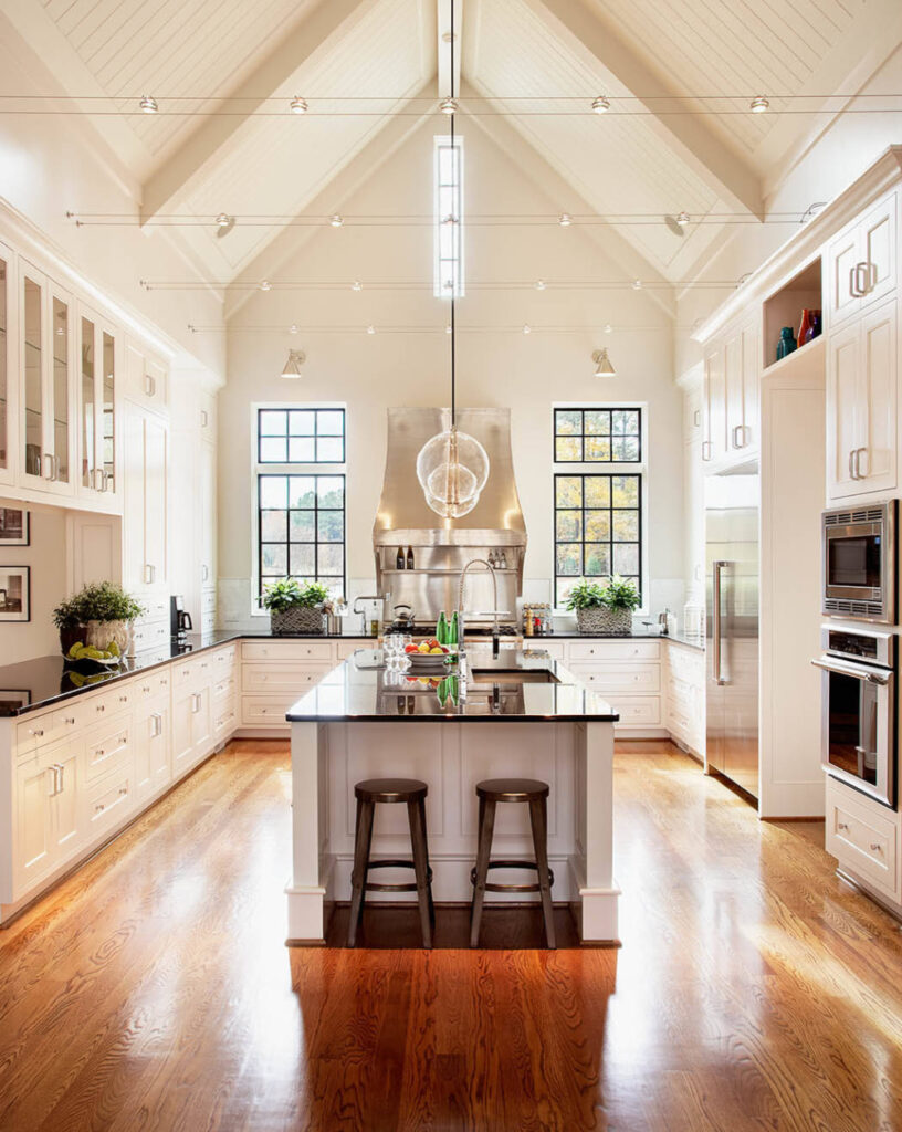 Ivory cream kitchen cabinets paired with warm oak floors for rental kitchens