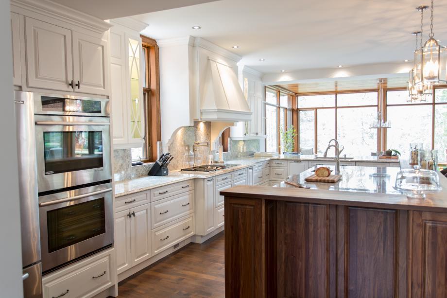 Cream cabinets kitchen design featuring walnut uppers for upscale appeal