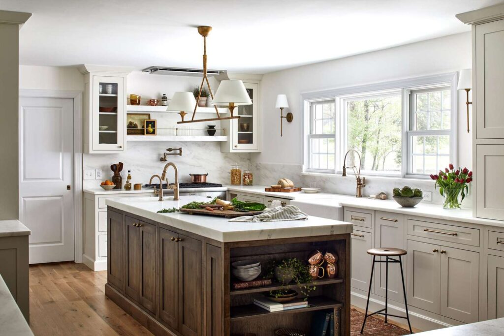 Greige cream colored kitchen cabinets paired with stainless steel for a contemporary design