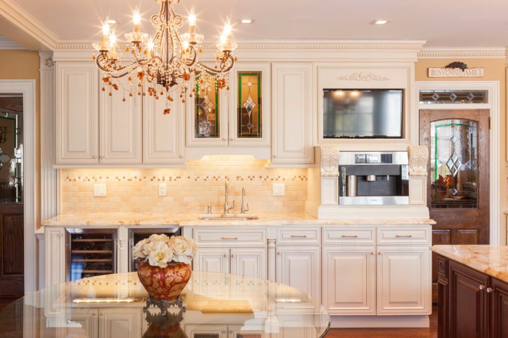 Antique cream kitchen cabinets paired with bronze handles for heritage kitchens