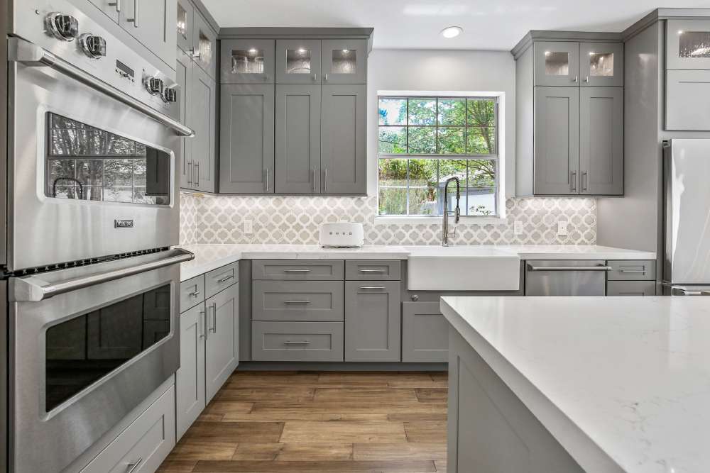Cool gray kitchen cabinet colors offering modern balance in LED-lit interiors