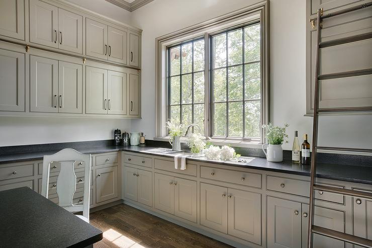 Greige kitchen cabinet colors combined with brushed nickel for broad appeal