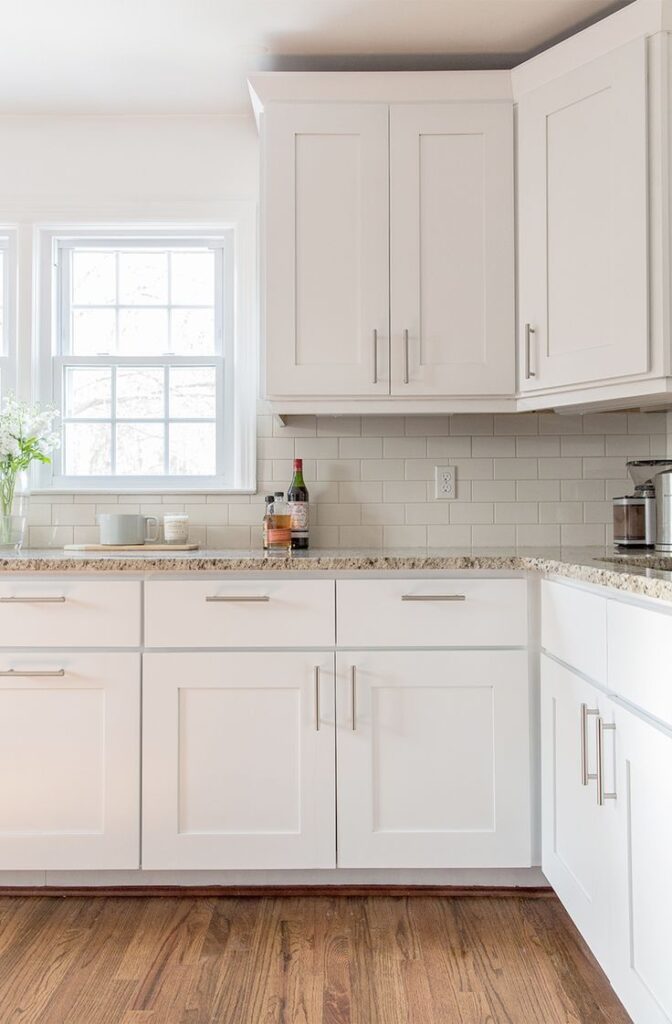 Brushed nickel hardware from kitchen cabinet hardware manufacturers paired with modern slab cabinets