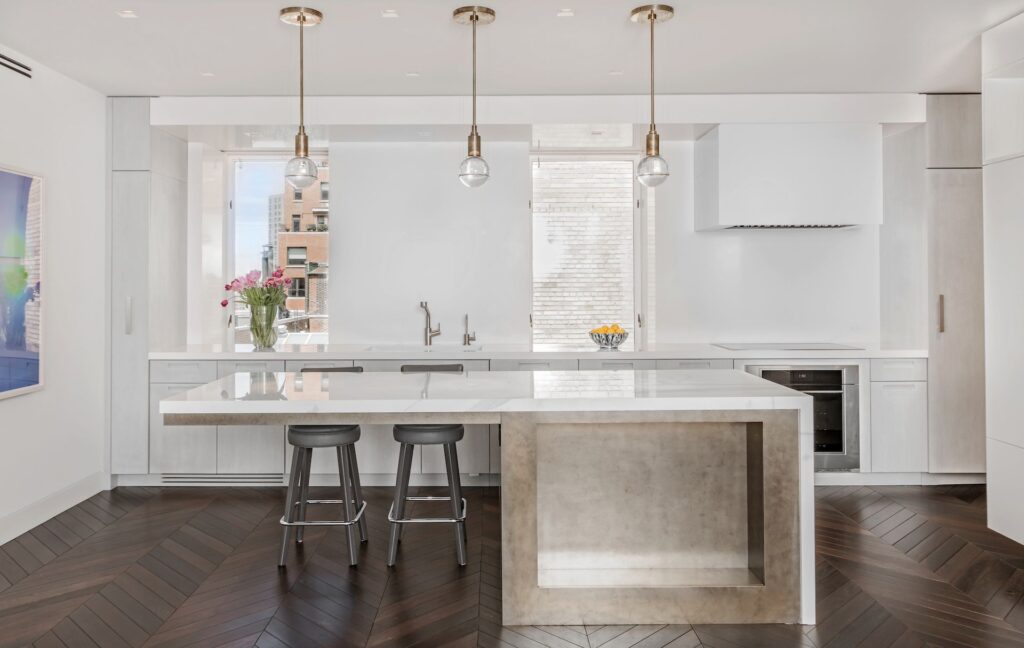 Sleek minimalist European style kitchen cabinets with handleless white doors