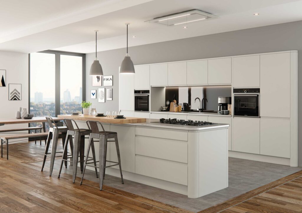 Matte white modern kitchen cabinets in a minimalist coastal-style interior