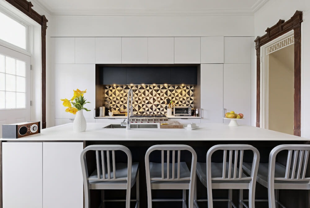 Modern open-plan kitchen featuring seamless cabinetry integration and efficient workflow circulation