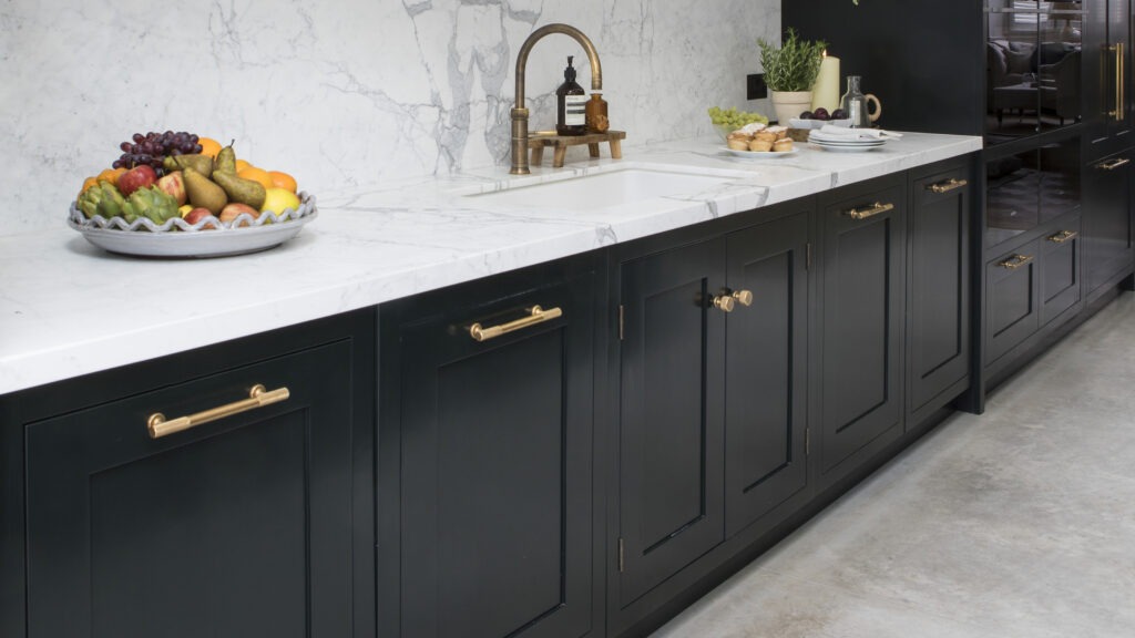 Modern black kitchen cabinets with metal handles