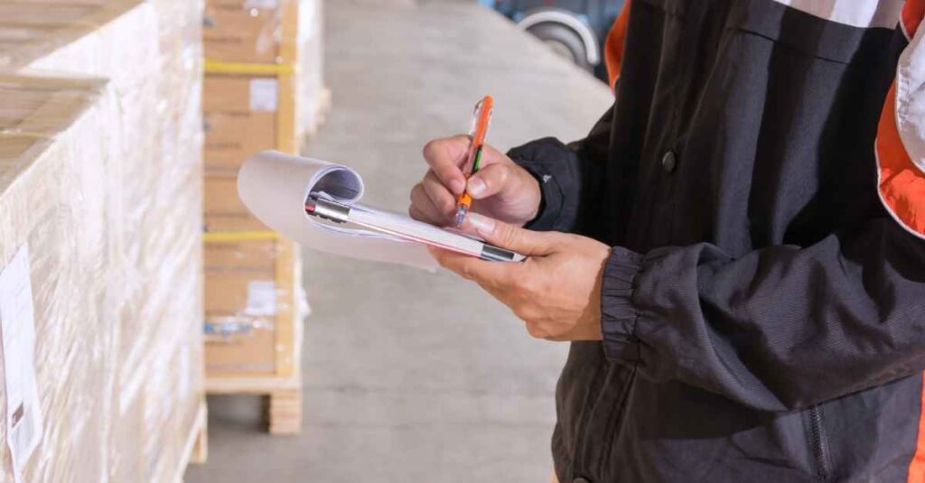 Inspectors reviewing completed MDF cabinet components before final shipment from factory