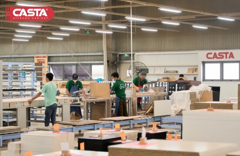Factory workers assembling MDF kitchen cabinet frames inside Casta’s Vietnam facility