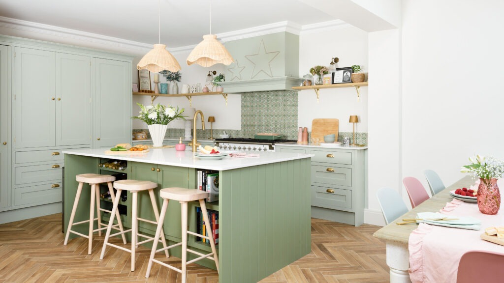 Green and white kitchen cabinets in calm interior