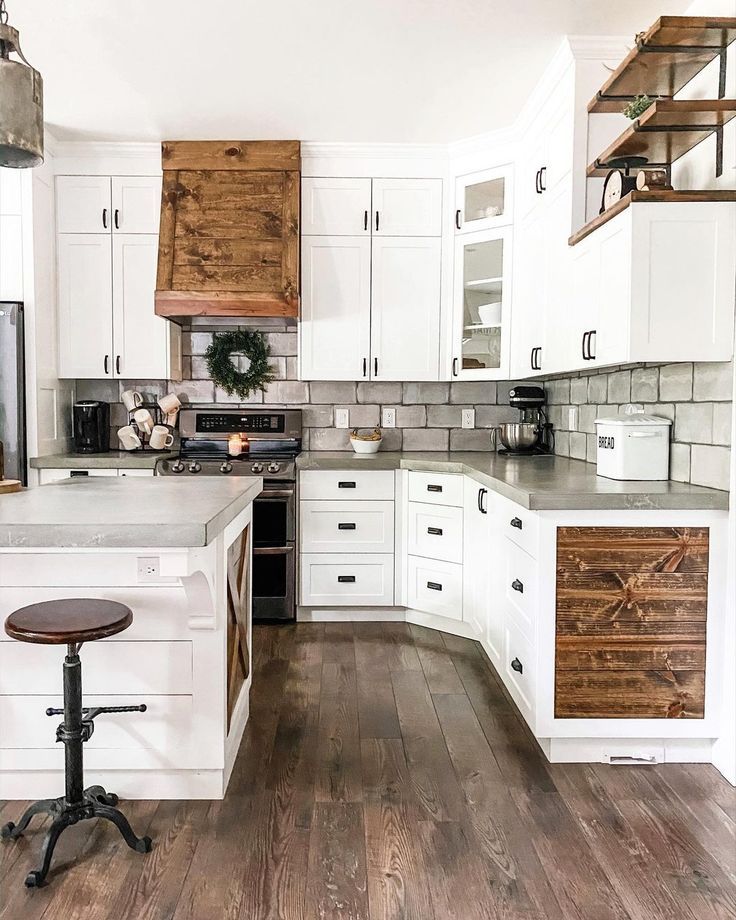 White kitchen cabinets with wood accents