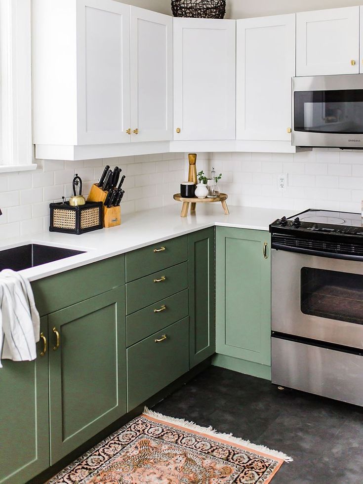 Green and white kitchen cabinets in modern design