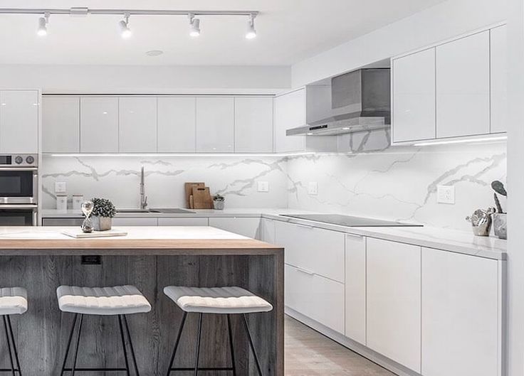 High-gloss white kitchen cabinets in modern apartment