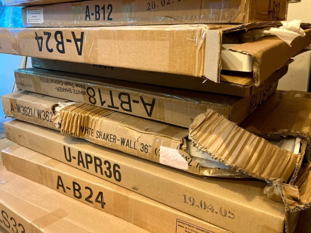 Freight damage from poorly packaged cheap kitchen cabinets shipment