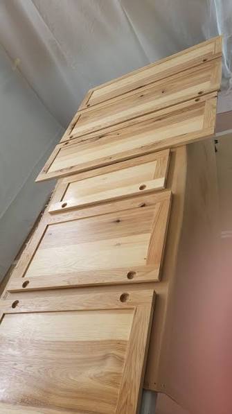 Pre-catalyzed lacquer spray application on cabinet panel