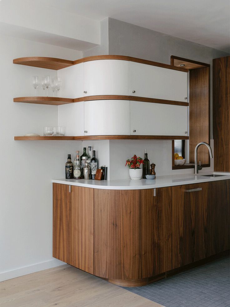 Curved-front stylish kitchen cabinets with mid-century styling