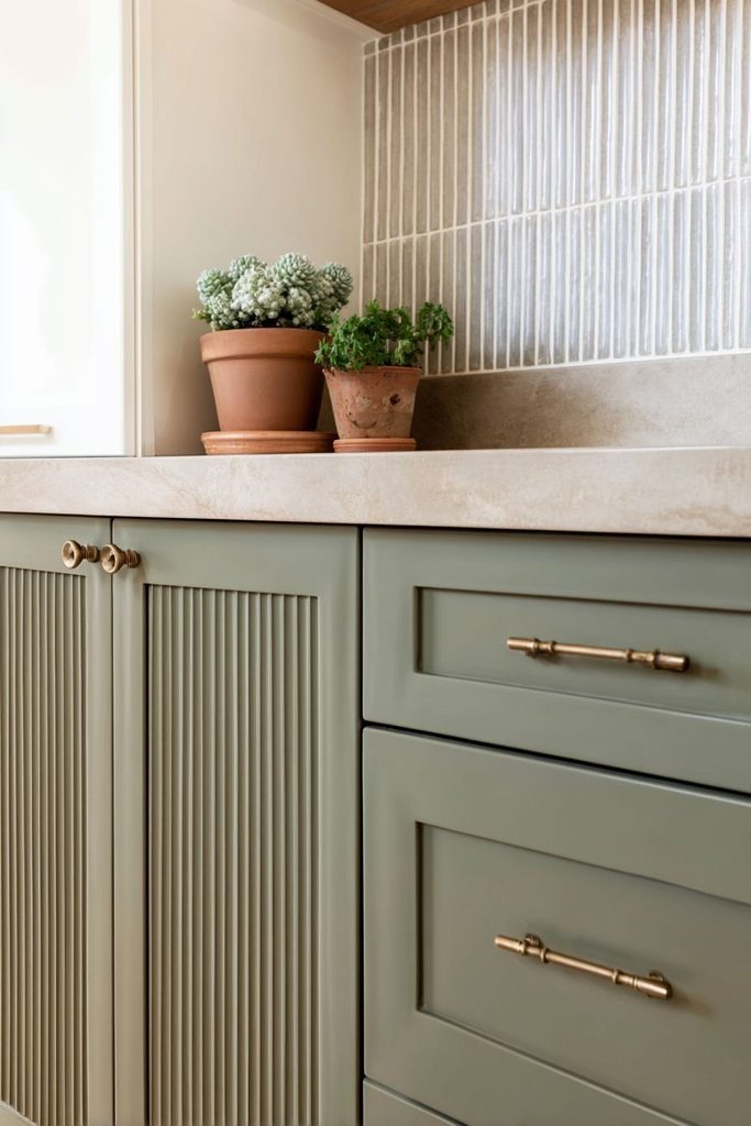 Fluted-front stylish kitchen cabinets with brass hardware