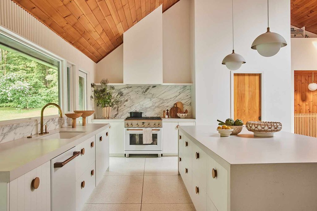 Coastal-neutral stylish kitchen cabinets in a mid-century layout