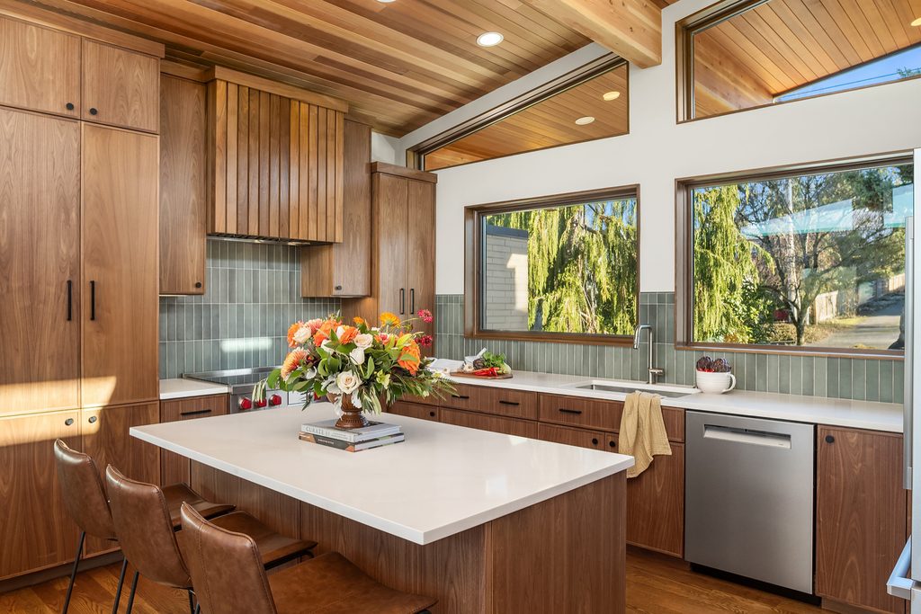 Warm modern stylish kitchen cabinets in a curated interior setting