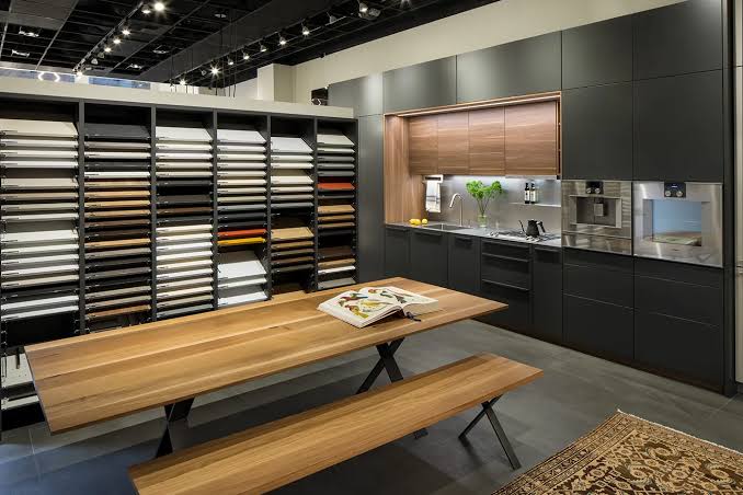 House-brand stylish kitchen cabinets displayed in a retail showroom