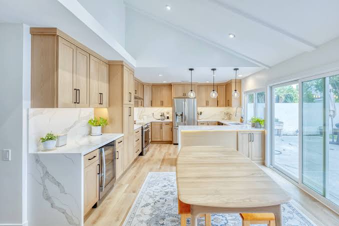 Warm white oak upscale kitchen cabinets, a leading current design trend