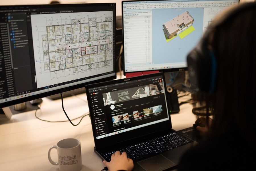 Engineer reviewing cabinet shop drawings on a computer screen