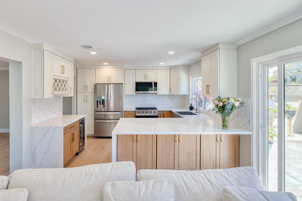 Model home kitchen with white shaker cabinets