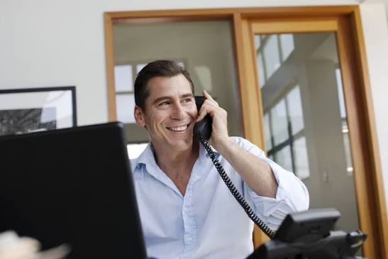 Property manager on a phone call with a cabinet supplier