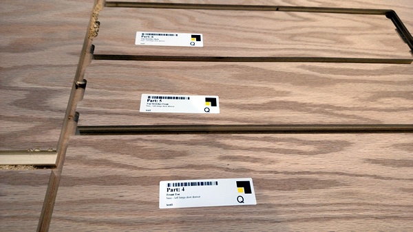 Compliance label on a composite wood cabinet panel