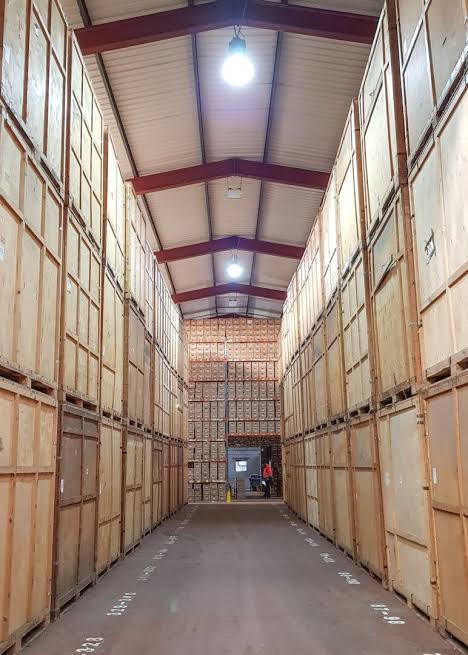 Wood furniture pieces stored in a warehouse